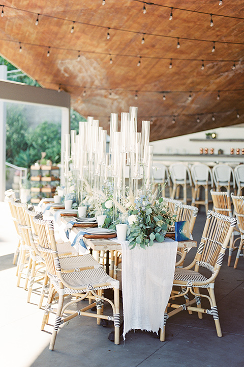  blue beachy wedding with blue and pink décor and the groom in a light blue suit – tables 