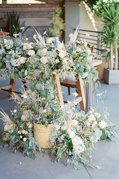  blue beachy wedding with blue and pink décor and the groom in a light blue suit – tables 