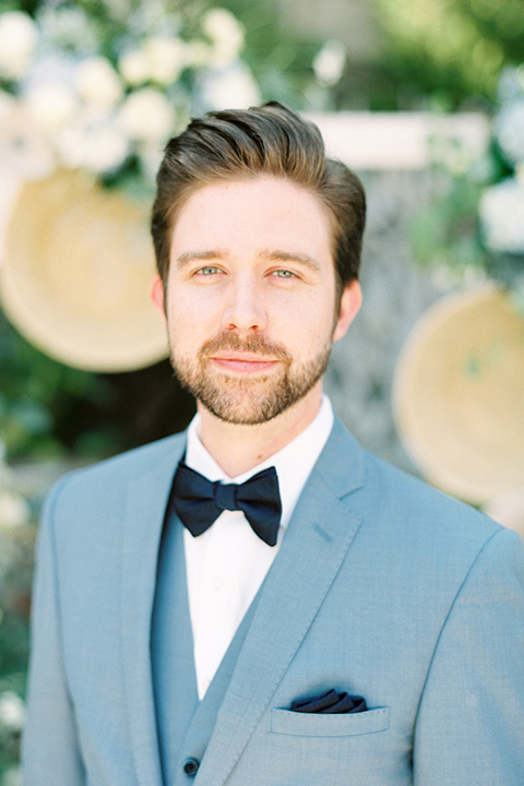  blue beachy wedding with blue and pink décor and the groom in a light blue suit – groom 