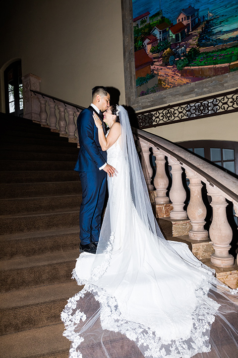  blue wedding on the sand - couple on the stairs 