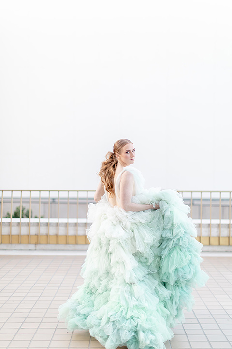  fun wedding at the Westgate hotel and the bride in a blue tulle gown and the groom in a white and black tuxedo - bride 