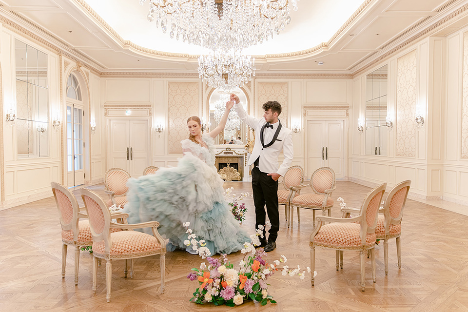  fun wedding at the Westgate hotel and the bride in a blue tulle gown and the groom in a white and black tuxedo – couple dancing 