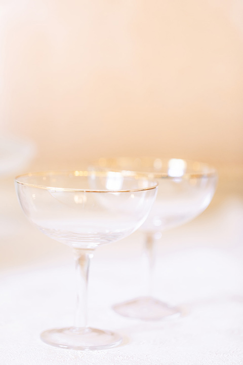  fun wedding at the Westgate hotel and the bride in a blue tulle gown and the groom in a white and black tuxedo - tabletop décor 