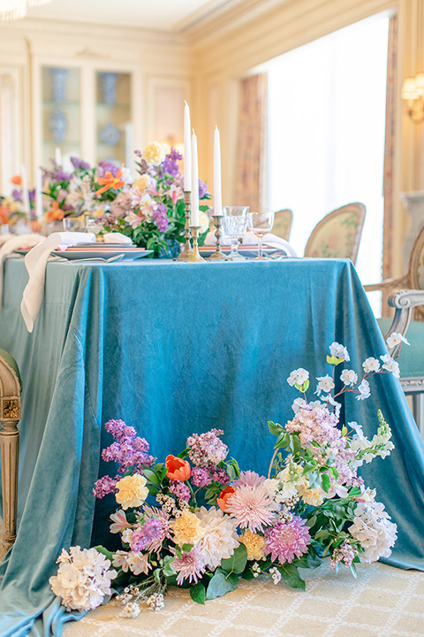  fun wedding at the Westgate hotel and the bride in a blue tulle gown and the groom in a white and black tuxedo - tables 