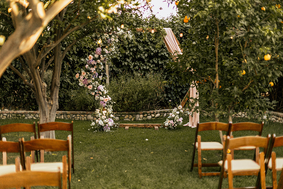  whimsical fairytale wedding with the groom in a gold velvet tuxedo – ceremony