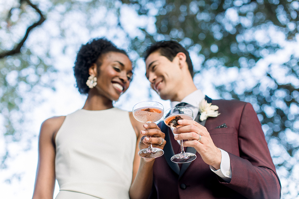  wine country wedding with the bride in a jumpsuit and the groom in a burgundy tux- drinks 
