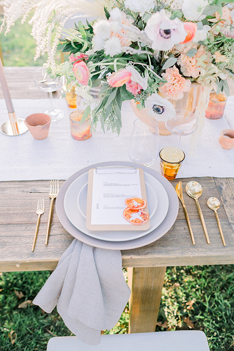  wine country wedding with the bride in a jumpsuit and the groom in a burgundy tux- flatware