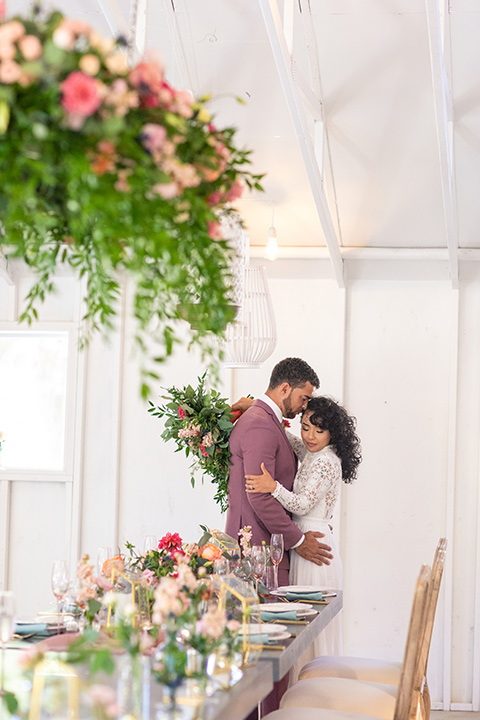  rose pink garden wedding with romantic rustic details – couple at the table