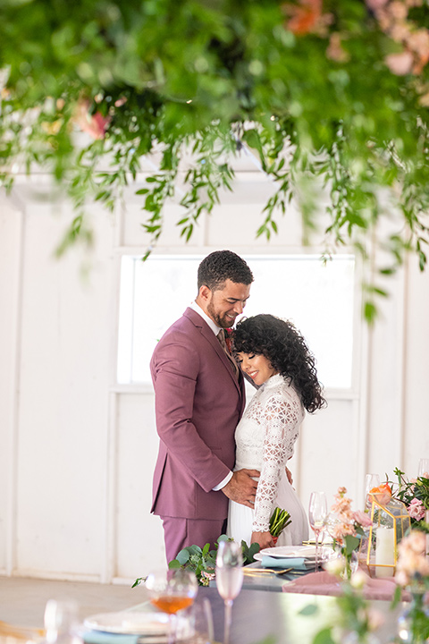  rose pink garden wedding with romantic rustic details – couple at the table 