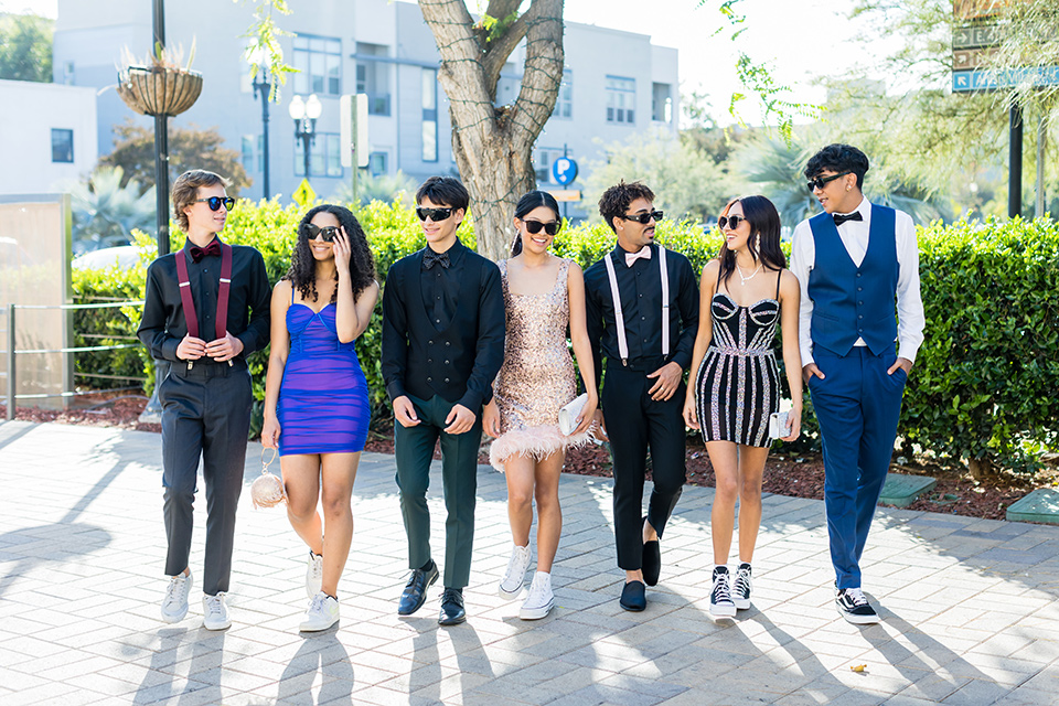  winter formal dance checklist and style tips – group walking in their shorter dresses and laid back looks