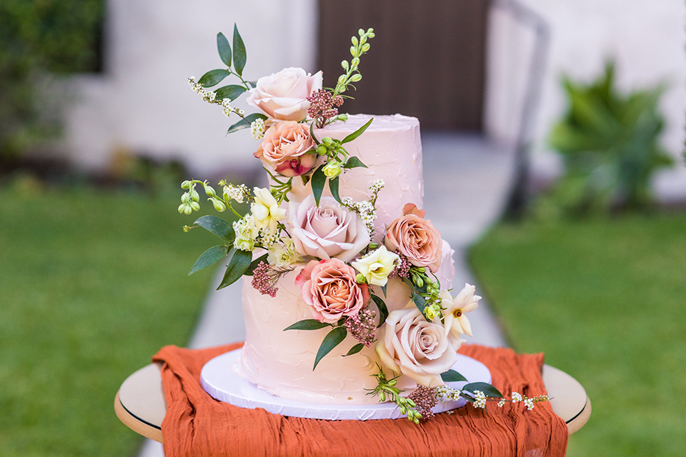  fun pink and champagne wedding with the bride in a pink tulle gown and the groom n a tan and pink look- cake