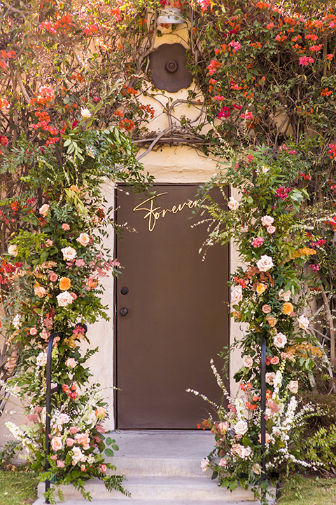  a California wedding with Spanish flare with the bride in a strapless gown and the groom in a gold velvet tux – couple getting ready 