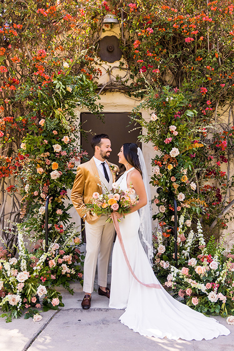  fun pink and champagne wedding with the bride in a pink tulle gown and the groom n a tan and pink look- groom 