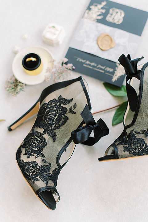  black and white modern wedding at the caramel mountain estate with the bride in a lace gown and the groom in a black velvet tuxedo – bridal shoes 