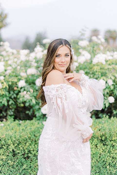  black and white modern wedding at the caramel mountain estate with the bride in a lace gown and the groom in a black velvet tuxedo – bride in her wedding gown 