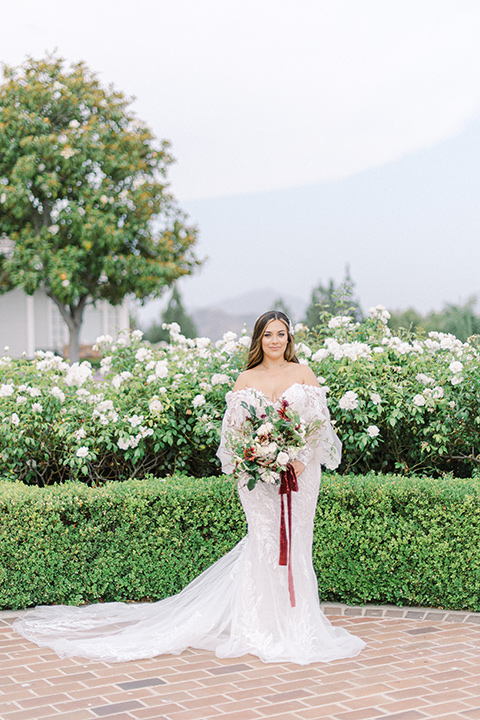  black and white modern wedding at the caramel mountain estate with the bride in a lace gown and the groom in a black velvet tuxedo –  bride in her wedding gown 