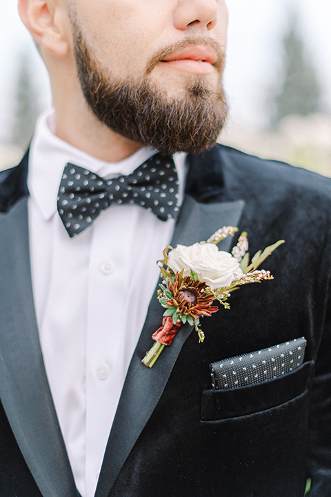  black and white modern wedding at the caramel mountain estate with the bride in a lace gown and the groom in a black velvet tuxedo – groom 