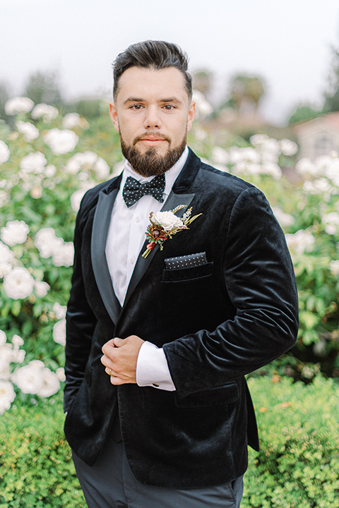  black and white modern wedding at the caramel mountain estate with the bride in a lace gown and the groom in a black velvet tuxedo –  groom 