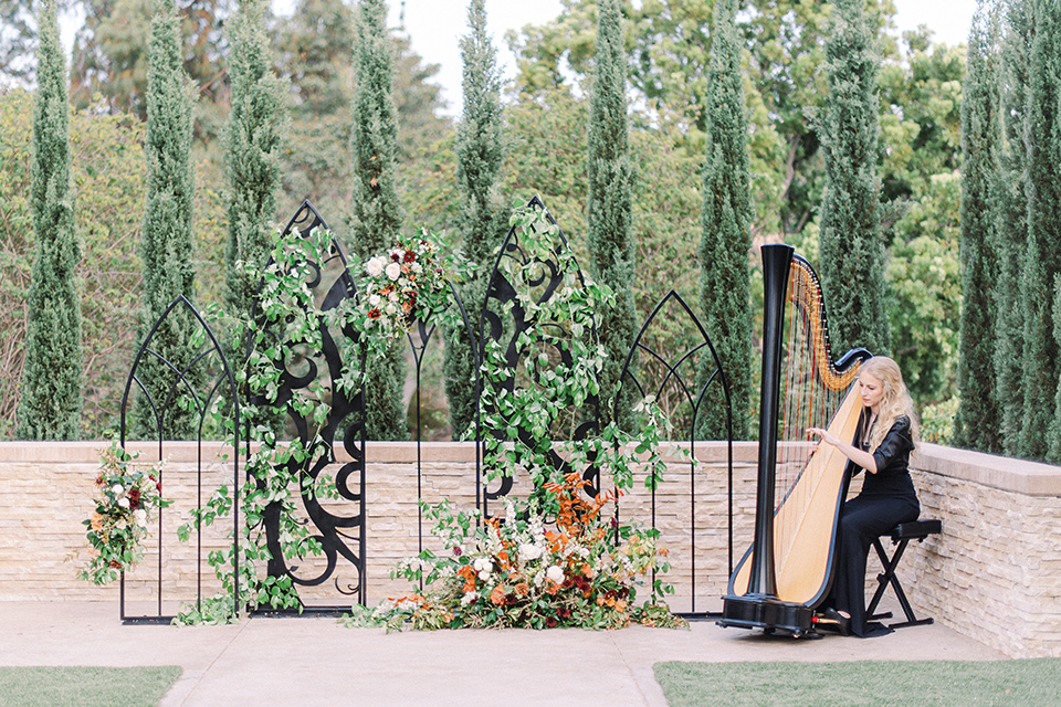  black and white modern wedding at the caramel mountain estate with the bride in a lace gown and the groom in a black velvet tuxedo – ceremony decor 