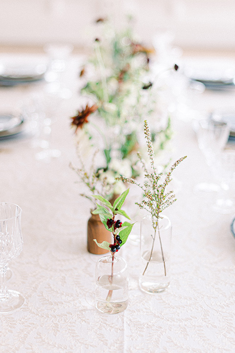  black and white modern wedding at the caramel mountain estate with the bride in a lace gown and the groom in a black velvet tuxedo –  black and white wedding reception decor 