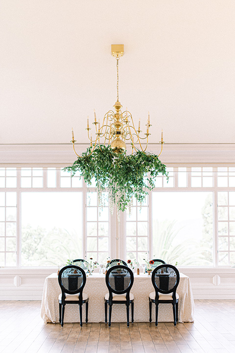  black and white modern wedding at the caramel mountain estate with the bride in a lace gown and the groom in a black velvet tuxedo –  black and white wedding reception decor 