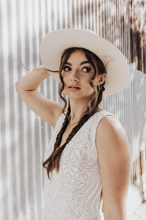  bohemian wedding with neutral colors and the groom in a gold velvet tuxedo – bride in boho gown and wide brimmed hat 