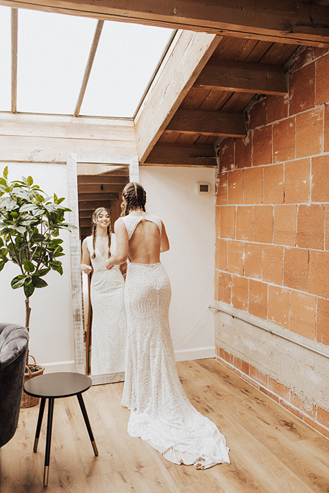  bohemian wedding with neutral colors and the groom in a gold velvet tuxedo – bride in boho gown and wide brimmed hat