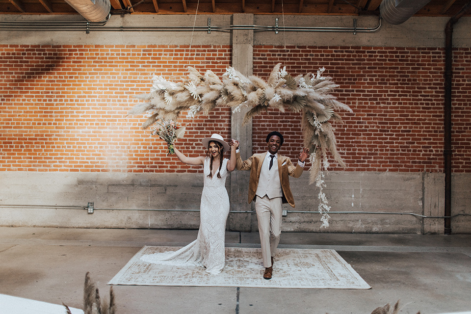 bohemian wedding with neutral colors and the groom in a gold velvet tuxedo – ceremony 