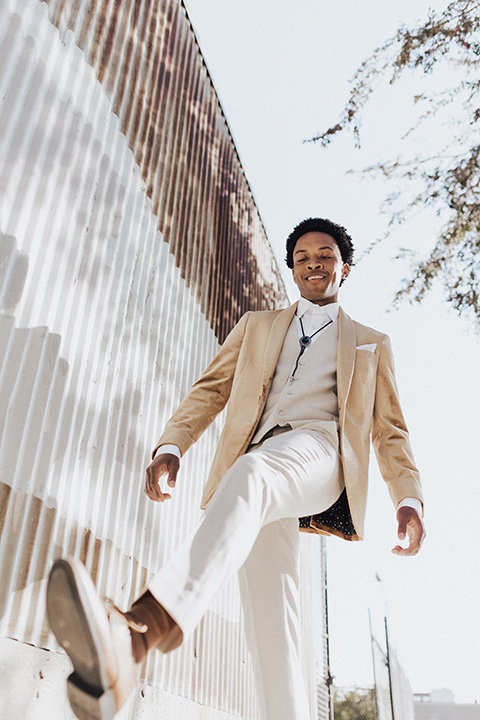  bohemian wedding with neutral colors and the groom in a gold velvet tuxedo – groom 