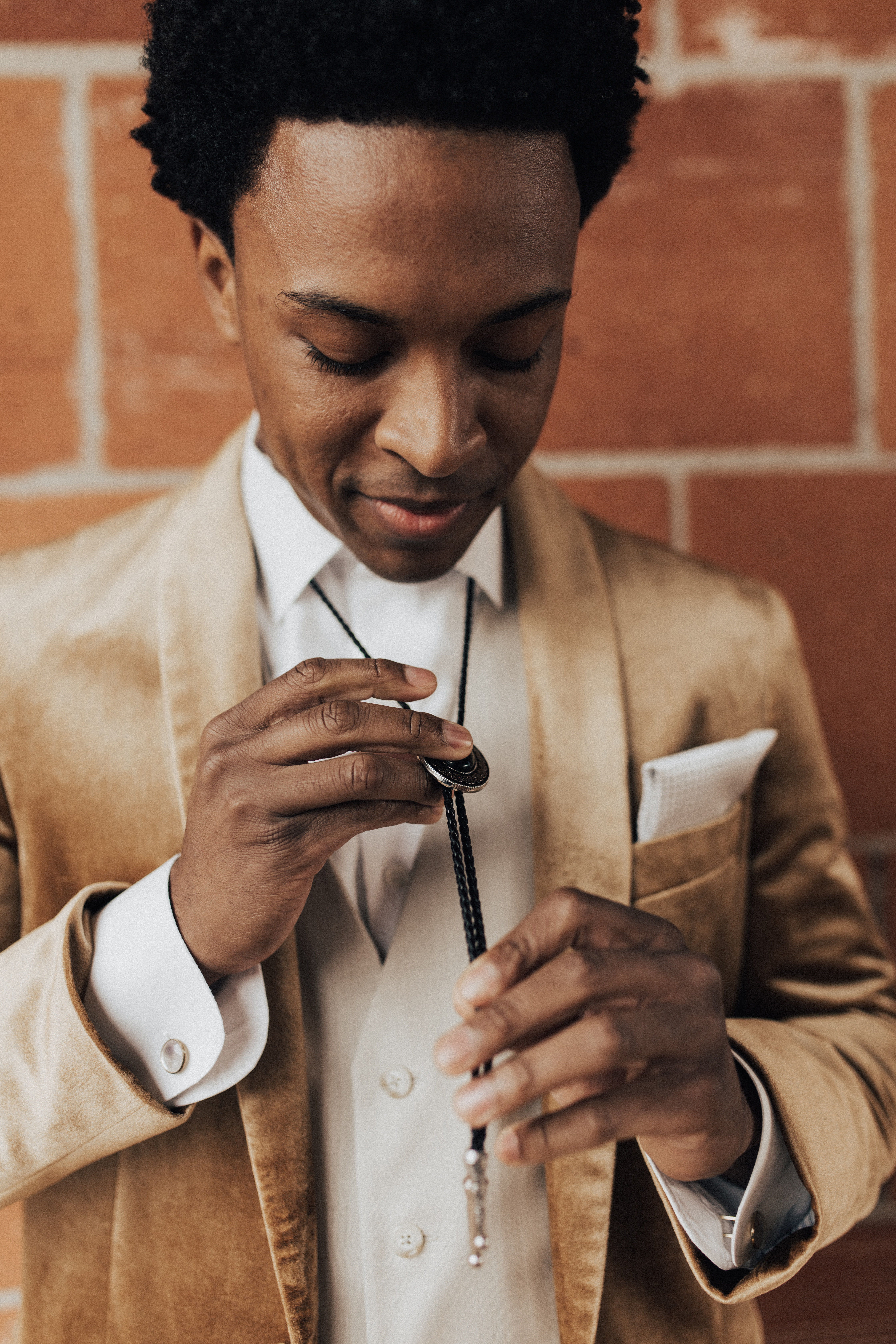  bohemian wedding with neutral colors and the groom in a gold velvet tuxedo – groom 