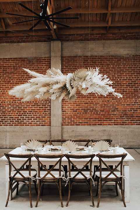  bohemian wedding with neutral colors and the groom in a gold velvet tuxedo – reception décor and floating florals 