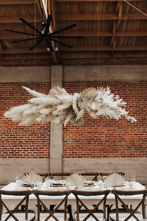  bohemian wedding with neutral colors and the groom in a gold velvet tuxedo – reception décor and floating florals 