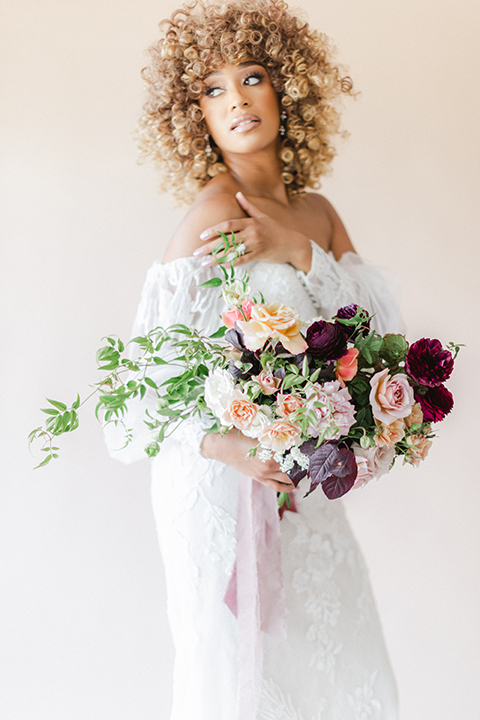  black and white classic wedding with the bride in a modern ballgown with billow sleeves and the groom in a black tuxedo – bride 