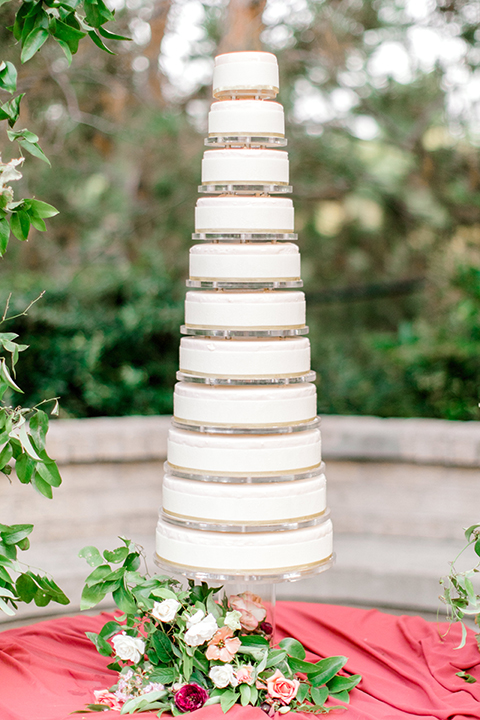  black and white classic wedding with the bride in a modern ballgown with billow sleeves and the groom in a black tuxedo – cake 