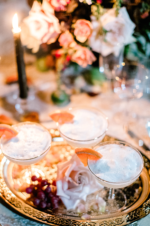  black and white classic wedding with the bride in a modern ballgown with billow sleeves and the groom in a black tuxedo – cocktails 