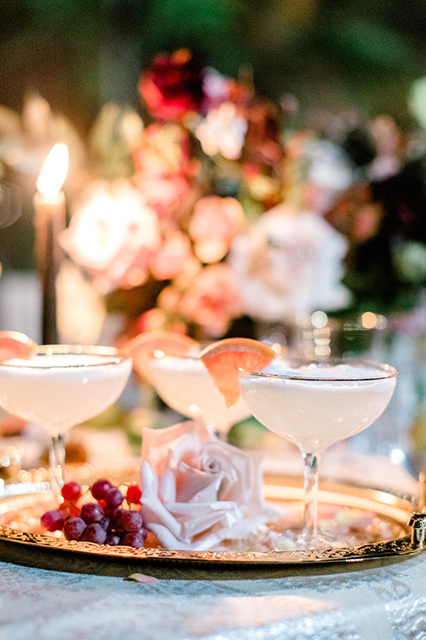  black and white classic wedding with the bride in a modern ballgown with billow sleeves and the groom in a black tuxedo – cocktails