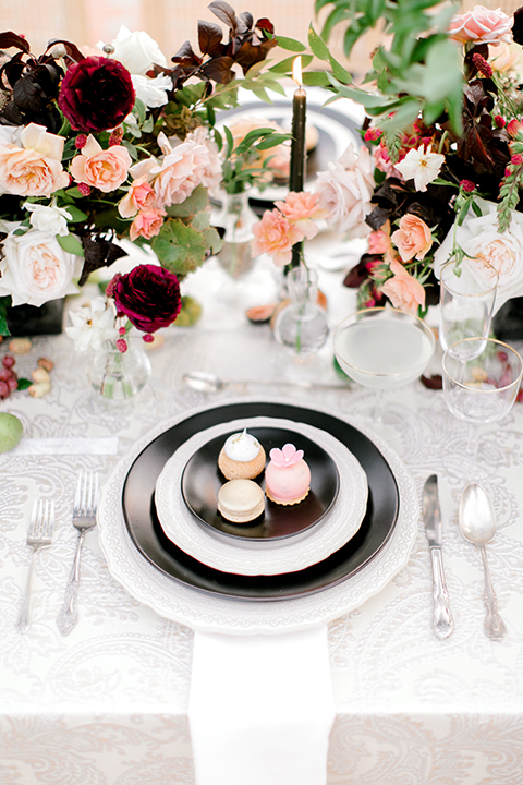  black and white classic wedding with the bride in a modern ballgown with billow sleeves and the groom in a black tuxedo – flatware 