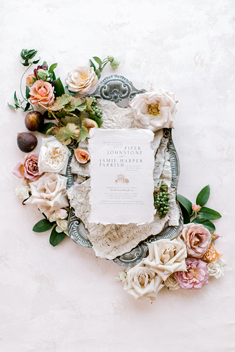  black and white classic wedding with the bride in a modern ballgown with billow sleeves and the groom in a black tuxedo – invitations 