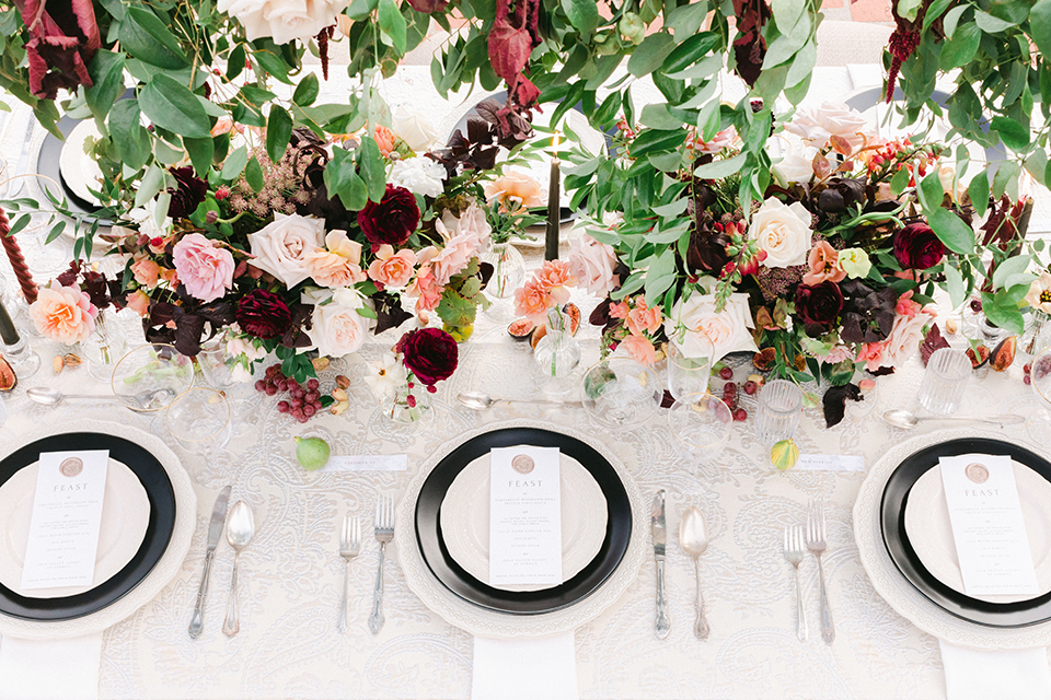  black and white classic wedding with the bride in a modern ballgown with billow sleeves and the groom in a black tuxedo – flatware