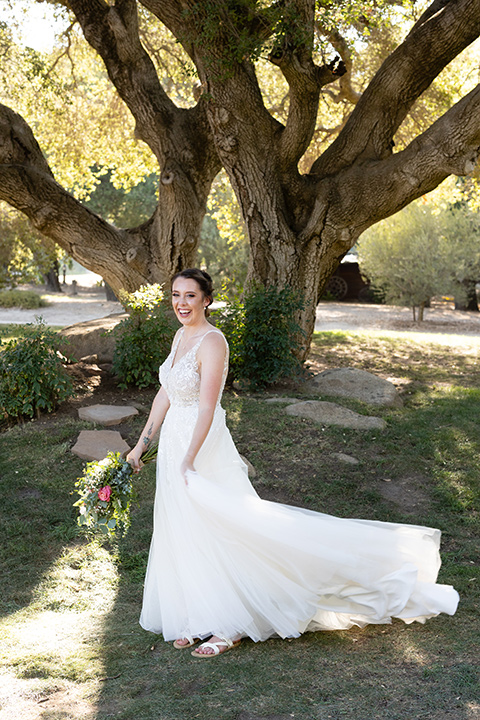  a California wedding with Spanish flare with the bride in a strapless gown and the groom in a gold velvet tux – bride 
