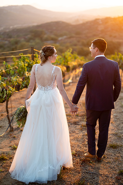  fun pink and champagne wedding with the bride in a pink tulle gown and the groom n a tan and pink look- sunset 