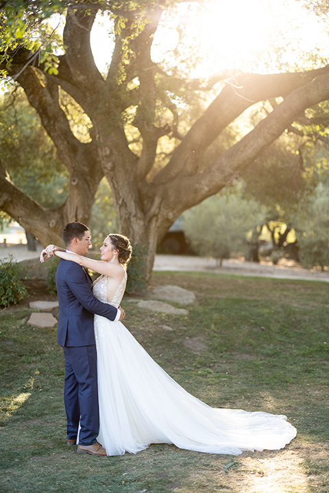  a California wedding with Spanish flare with the bride in a strapless gown and the groom in a gold velvet tux – sunset 