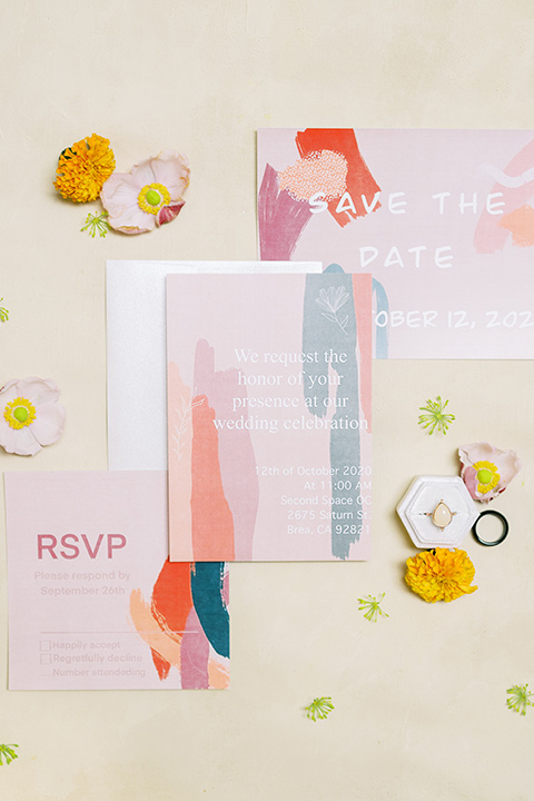  colorful modern wedding with the bride in a fitted gown and the groom in an ivory coat and pink pants – invitations 