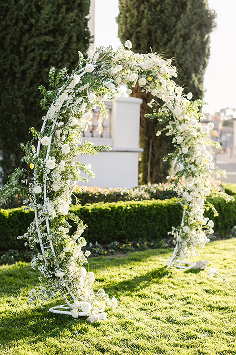  English garden romantic wedding with the bride in an off-the-shoulder gown and the groom in a tan suit – ceremony decor 