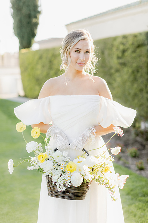  English garden romantic wedding with the bride in an off-the-shoulder gown and the groom in a tan suit – bride