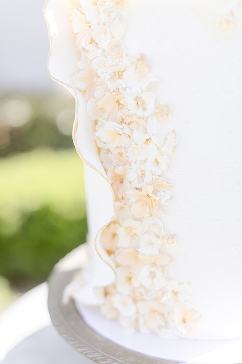  elevated cottagecore wedding design with the bride in a long sleeve ball gown and the groom in a tan suit - bride