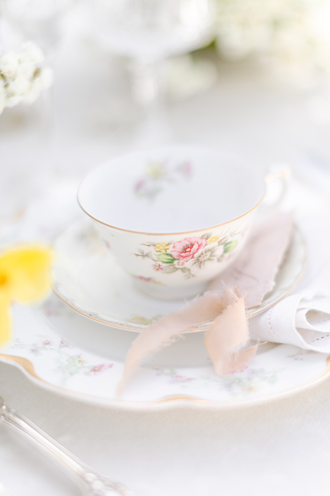  English garden romantic wedding with the bride in an off-the-shoulder gown and the groom in a tan suit – table decor 