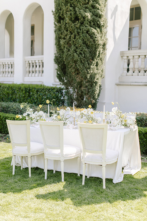  English garden romantic wedding with the bride in an off-the-shoulder gown and the groom in a tan suit – table decor 