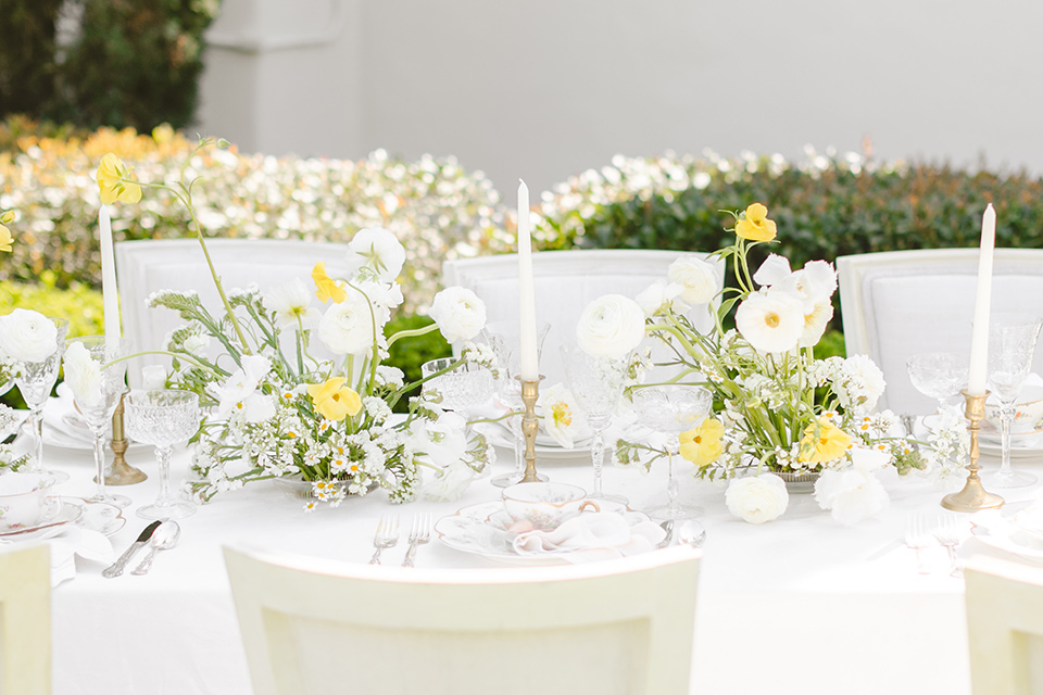  English garden romantic wedding with the bride in an off-the-shoulder gown and the groom in a tan suit – table decor 