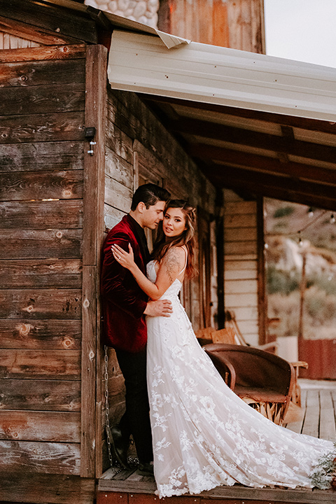  boho burgundy and beige wedding in the dessert – couple at the venue 
